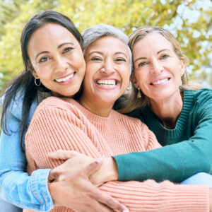Retirement, women or bonding hug for portrait profile picture, social media or lifestyle freedom blog in relax environment. Smile, happy or elderly senior friends in nature park, garden or community.